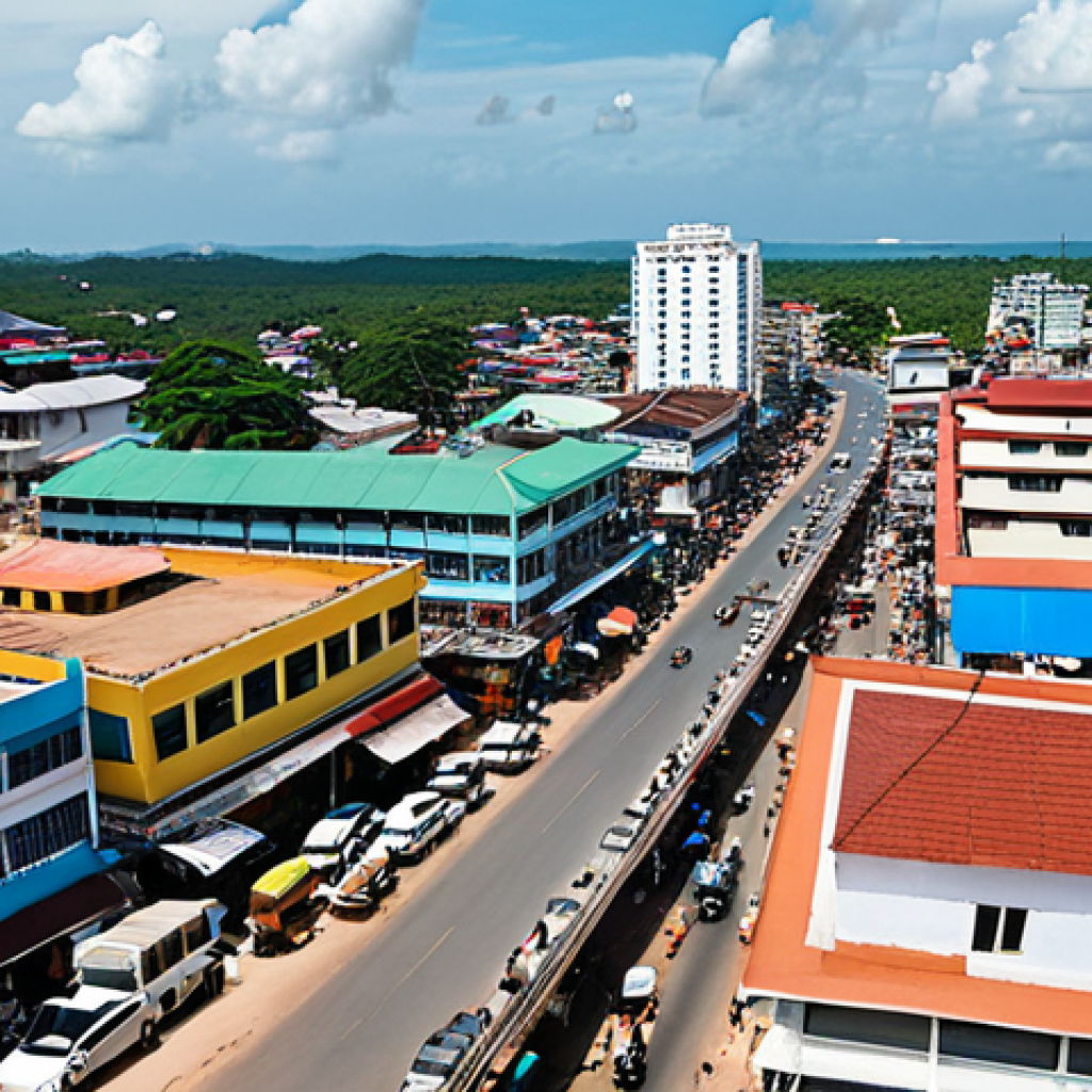 **

> Bustling cityscape of Sihanoukville, Cambodia, showcasing a blend of traditional coastal town and modern industrial zone. Capture the contrast between older, smaller buildings and rising skyscrapers. Include busy streets filled with vehicles and people, reflecting the rapid economic transformation. Incorporate elements of the coast, suggesting its location. Style: realistic, vibrant colors.

**